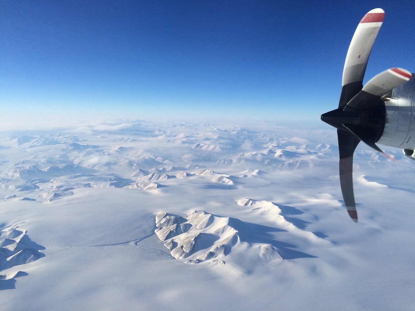 Greenland snowy mountains from NASA's P3. Photo: Caitlin Locke (LDEO)