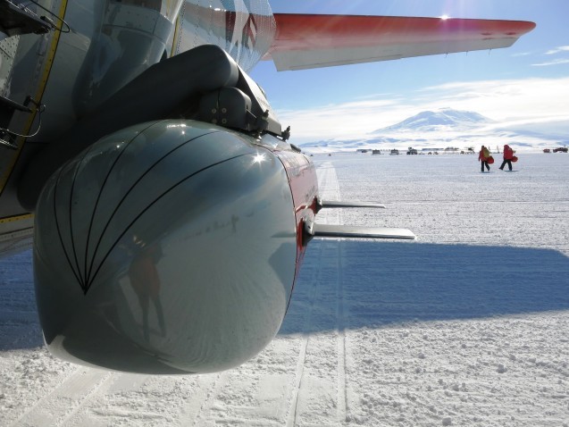 IcePod attached to LC130 on Ross Ice Shelf with active volcano Mt. Erebus in the distance. Photo: Sarah Starke