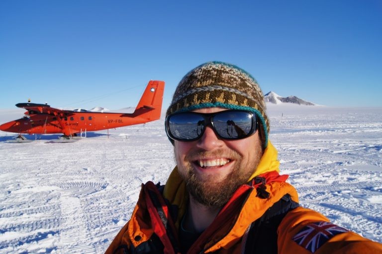 Dave Porter arriving in the field with the twin otter survey plane in the background. Photo: Dave Porter (LDEO) Dave Porter arriving in the field with the twin otter survey plane in the background. Photo: Dave Porter (LDEO)
