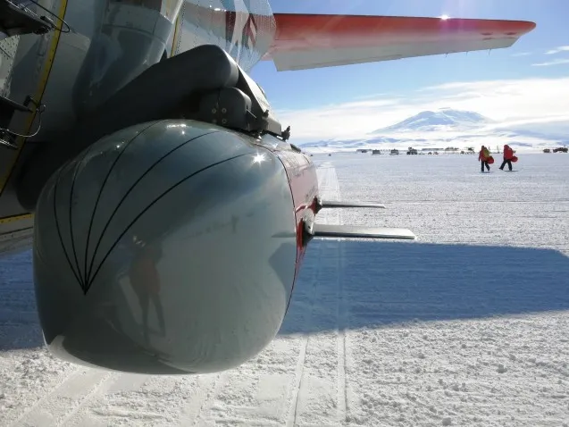 IcePod attached to LC130 on Ross Ice Shelf with active volcano Mt. Erebus in the distance. Photo: Sarah Starke
